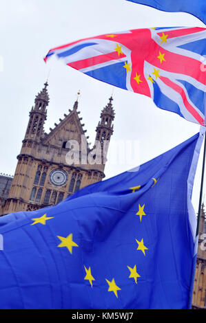London, UK. 5th Dec, 2017. The flags of pro-European protesters at Westminster with the houses of parliament as a backdrop. European flag and union jack or flag with the European stars incorporated in the flag visually stating the case for Britain to remain in European union and to spend the money on issues that benefit the nation like the NHS. Colourful anti-brexit pro-European flags and banners at the houses of parliament in Westminster, London. Credit: Steve Hawkins Photography/Alamy Live News Stock Photo
