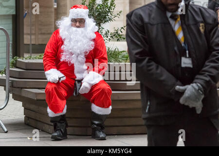 London, UK. 5th Dec, 2017. City traders arrive in fancy dress ready to attend the annual ICAP Charity Day. Credit: Guy Corbishley/Alamy Live News Stock Photo