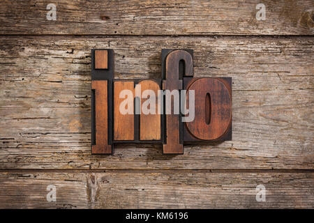 info, single word set with vintage letterpress printing blocks on rustic wooden background Stock Photo