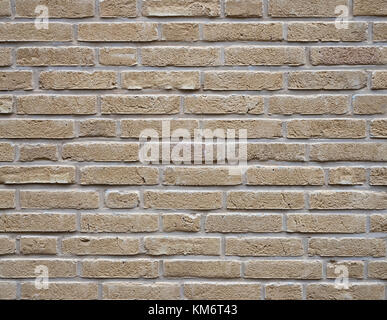 part of yellow creme brick wall with cement joints Stock Photo