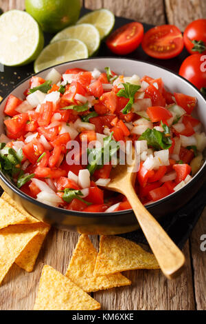 Mexican food: Pico de Gallo close-up in a bowl on the table. vertical Stock Photo