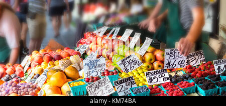 Fruits with tag prices on stands in an outdoors fruit market in Seattle, Washington. Stock Photo