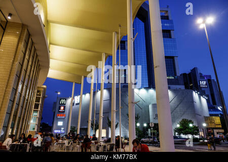 Porto Portugal,Mercado do Bom Sucesso,al fresco,sidewalk outside tables dining street cafe,dining,outdoor,cafe,tables,exterior outside,dusk,night even Stock Photo