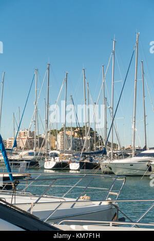 The port of Denia on the Costa Blanca, Spain with luxury yachts, a retail shopping area and bars, restaurants Stock Photo