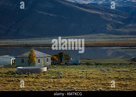 Old corrugated steel farmhouse and small lake near El Chalten, Patagonia, Argentina, South America Stock Photo