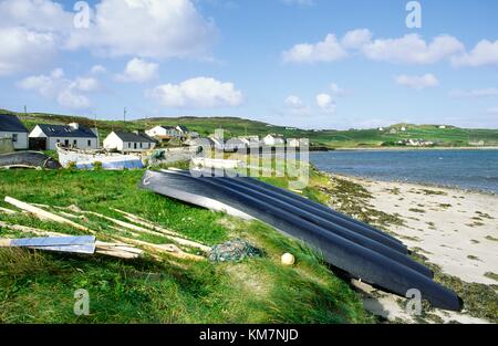 Traditional currachs stretched canvas boats on east coast of island of Inishbofin off the west coast of County Galway, Ireland Stock Photo