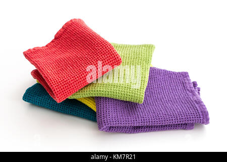 Messy and Folded Colorful Kitchen Towels, on White Stock Photo