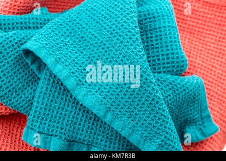 Messy and Folded Colorful Kitchen Towels, on White Stock Photo