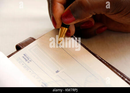 African Writing Money Cheque. Sign Check Or Paycheck Stock Photo - Alamy