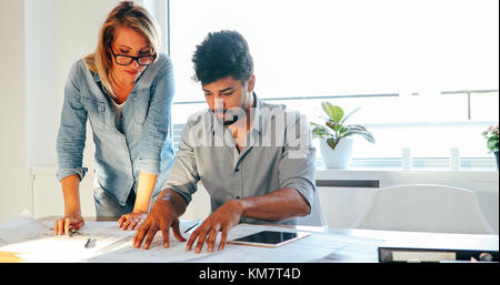 Architect colleagues working in office Stock Photo