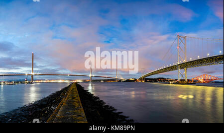 Night view of new Queensferry Crossing bridge and Forth Road Bridge spanning the Firth of Forth at South Queensferry in Scotland, United Kingdom Stock Photo