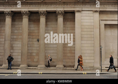 People walk past The Bank of England in London Stock Photo