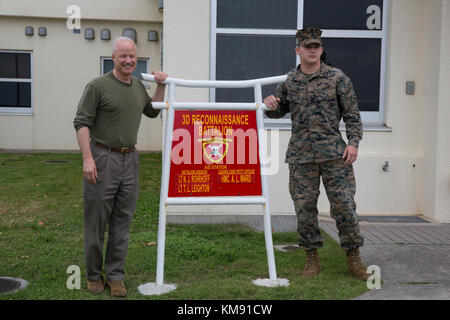 U.S. Rep. Mike Coffman visited 3rd Reconnaissance Battalion Marines on Camp Schwab in Okinawa, Japan, November 26, 2017.  Coffman is a congressman for the state of Colorado. Lance Cpl. Trent Thomas, a native of Thornton, Colorado, is a small craft mechanic with 3rd Reconnaissance Battalion, 3rd Marine Division, III Marine Expeditionary Force. Stock Photo