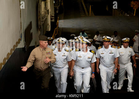 CWO4 James Randall describes features of the amphibious assault ship USS Wasp (LHD 1) to Brazilian navy officials. Wasp is transiting to Sasebo, Japan to conduct a homeport shift with USS Bonhomme Richard (LHD 6) as the flag ship of amphibious forces in the U.S. 7th Fleet are of operations. Stock Photo