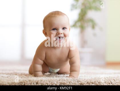 crawling funny baby boy indoors at home Stock Photo - Alamy