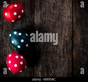 Dotted Easter eggs on the wooden background with blank space on right side Stock Photo