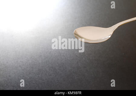 empty spoon on black background, large copy space Stock Photo