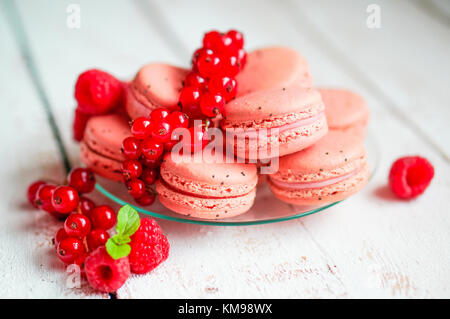 Raspberry Macaroons With Berries On Wooden Table Stock Photo