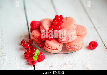 Raspberry Macaroons With Berries On Wooden Table Stock Photo