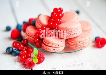 Raspberry Macaroons With Berries On Wooden Table Stock Photo