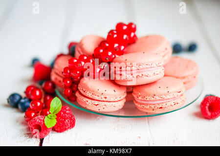 Raspberry Macaroons With Berries On Wooden Table Stock Photo