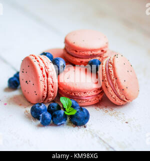 Raspberry Macaroons With Berries On Wooden Table Stock Photo