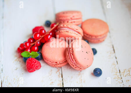 Raspberry Macaroons With Berries On Wooden Table Stock Photo