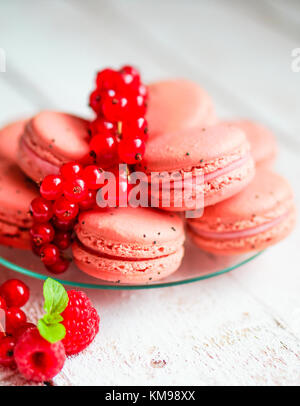 Raspberry Macaroons With Berries On Wooden Table Stock Photo