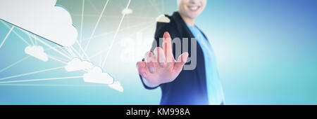 Mid section of smiling businesswoman touching imaginary interface against abstract green background, Stock Photo