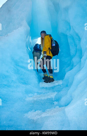 Hiker in ice cave, Perito Moreno Glacier, Parque Nacional Los Glaciares (World Heritage Area), Patagonia, Argentina, South America (MR) Stock Photo