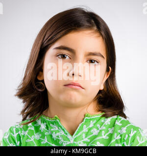 Portrait of a little girl making a serious expression Stock Photo