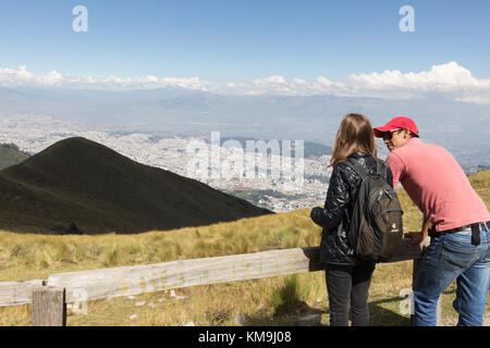 Ecuador - holiday, a young couple at the top of the Teleferiqo cable car, overlooking Quito, Ecuador South America Stock Photo