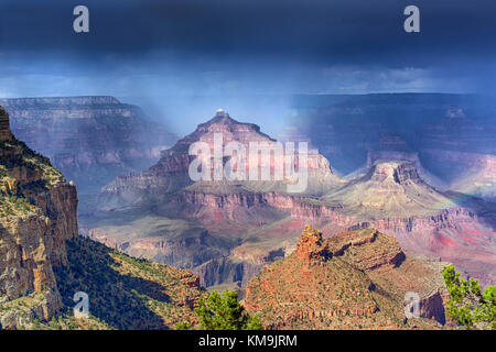 Rain over the Grand Canyon formations with ever changing light Stock Photo