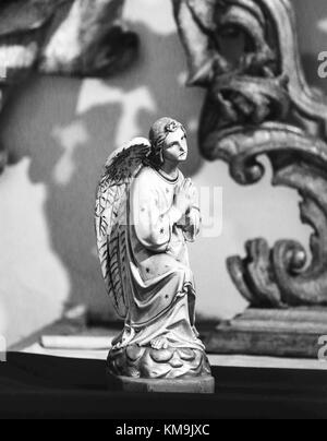 Statue of a Praying Angel in Loreta church, Prague Stock Photo