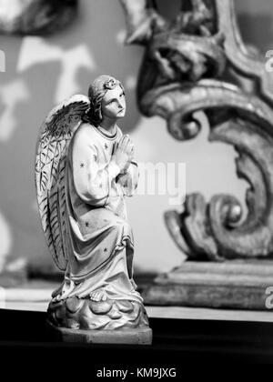 Statue of a Praying Angel in Loreta church, Prague Stock Photo