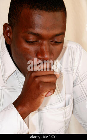 African man coughing Stock Photo