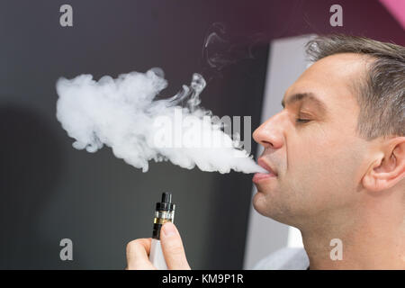 man using vapourizer as smoking alternative Stock Photo