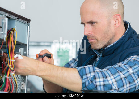 engineer repairs computers hard drive Stock Photo
