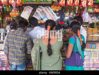 People shopping at kiosk in bus station, Mysore, Karnataka, India. Stock Photo