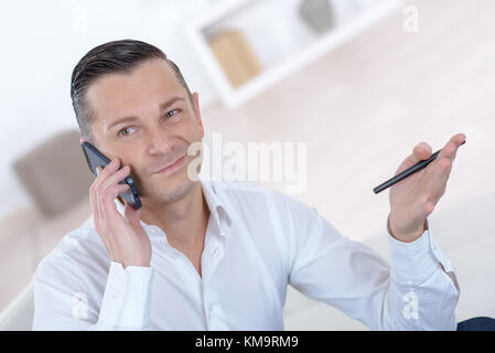 businessman calling on the cellular phone Stock Photo