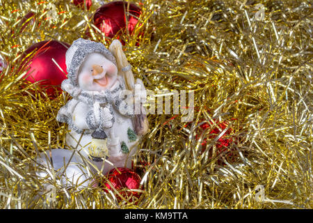Christmas garland with a snowman and red balls. Art decoration Stock Photo