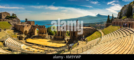 A panoramic view of the Ancient Theatre in Taormina, Sicily. Its position is unique as it overlooks both the Mediterranean sea and Etna Volcano Stock Photo