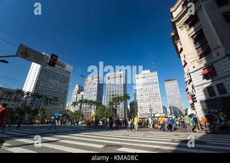 People walking at a crosswalk, crossing street at Praca Ramos de Azevedo, Republica, downtown Sao Paulo, Brazil Stock Photo