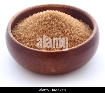 Brown sugar in wooden bowl over white background Stock Photo