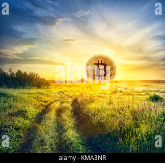 Bitcoin in the form of the rising sun Stock Photo