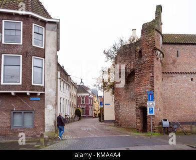 man enters old city of zwolle near ancient town wall Stock Photo