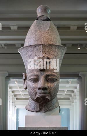 London. England. British Museum. Statue believed to be Egyptian Pharaoh Amenhotep III with double crown (Pschent), reworked to represent Ramesses II Stock Photo