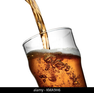 Closeup action shot of amber gold beer pouring into clear glass with bubbles and frothy head Stock Photo