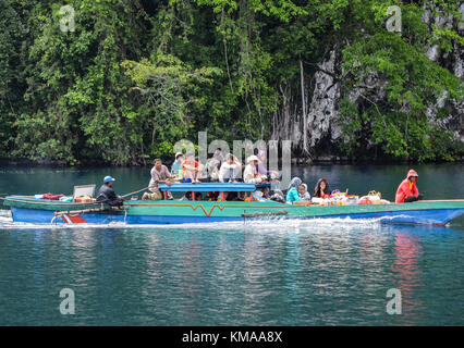 People who lived in the side of Matano lake mainly depend on traditional boat to transport people and supplies from city to their village. Stock Photo