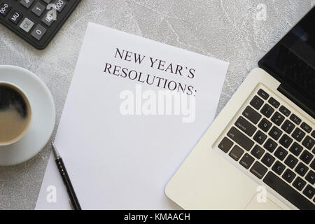 New Year's resolutions paper, laptop, stationery Stock Photo